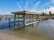 Covered boat lift on a private dock at 2 Richmond Dr, New Smyrna Beach, FL 32169