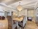 Dining area with built-in cabinetry and a stunning chandelier at 2 Richmond Dr, New Smyrna Beach, FL 32169