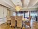 Bright dining room with a large wooden table and wicker chairs at 2 Richmond Dr, New Smyrna Beach, FL 32169