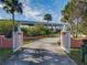 Elegant gated entrance to a waterfront property at 2 Richmond Dr, New Smyrna Beach, FL 32169