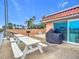 Outdoor patio with picnic tables and grills at 2 Richmond Dr, New Smyrna Beach, FL 32169