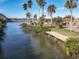 Waterfront property with private dock and lush landscaping at 2 Richmond Dr, New Smyrna Beach, FL 32169