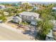 Two-story house with ocean view, palm trees, and a landscaped yard at 201 S Cooper St, New Smyrna Beach, FL 32169