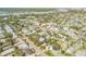 Aerial view showing home's location in a residential area near the water at 201 S Cooper St, New Smyrna Beach, FL 32169