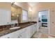 Double vanity bathroom with granite countertops at 201 S Cooper St, New Smyrna Beach, FL 32169