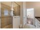 Bathroom with shower and granite vanity at 201 S Cooper St, New Smyrna Beach, FL 32169