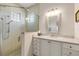 Bathroom with walk-in shower and modern vanity at 201 S Cooper St, New Smyrna Beach, FL 32169