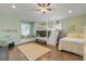 Spacious bedroom with built-in window seat, bunk beds, and wood flooring at 201 S Cooper St, New Smyrna Beach, FL 32169