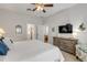 Bright bedroom with ceiling fan and en-suite bathroom at 201 S Cooper St, New Smyrna Beach, FL 32169