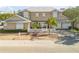 Tan two-story house with white shutters, white picket fence, and palm trees at 201 S Cooper St, New Smyrna Beach, FL 32169