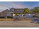 Beautiful two-story home featuring a three-car garage, lush landscaping, and a white picket fence at 201 S Cooper St, New Smyrna Beach, FL 32169