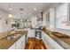 Modern kitchen featuring granite countertops and hardwood floors at 201 S Cooper St, New Smyrna Beach, FL 32169