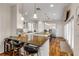 Kitchen with granite island, white cabinets and stainless steel appliances at 201 S Cooper St, New Smyrna Beach, FL 32169