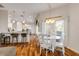 Kitchen with white cabinets, granite counters, and island seating at 201 S Cooper St, New Smyrna Beach, FL 32169