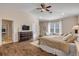 Main bedroom with hardwood floors and ceiling fan at 201 S Cooper St, New Smyrna Beach, FL 32169