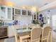 Bright dining room with built-in cabinetry and a unique chandelier at 205 Blue Starfish Pl, Daytona Beach, FL 32124