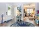 Inviting home foyer with decorative rug, stylish console table, and a glimpse into a cozy living area at 205 Blue Starfish Pl, Daytona Beach, FL 32124