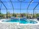 Relaxing screened-in pool area with tiled water features at 205 Blue Starfish Pl, Daytona Beach, FL 32124