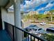 Balcony view overlooking the parking lot and surrounding neighborhood at 2100 N Peninsula Ave # 216, New Smyrna Beach, FL 32169