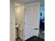 Small, updated half bathroom with pedestal sink at 2100 N Peninsula Ave # 216, New Smyrna Beach, FL 32169