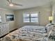 Spacious bedroom with king bed, window seat, and ocean view at 2100 N Peninsula Ave # 216, New Smyrna Beach, FL 32169