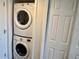 Stackable washer and dryer in a closet at 2100 N Peninsula Ave # 216, New Smyrna Beach, FL 32169