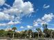 Distant view of the ocean and surrounding buildings from across the street at 2100 N Peninsula Ave # 216, New Smyrna Beach, FL 32169