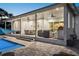 Covered patio with seating area and outdoor kitchen at 2302 S Atlantic Ave, New Smyrna Beach, FL 32169