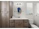 Clean bathroom with a vanity, toilet, and updated fixtures at 2302 S Atlantic Ave, New Smyrna Beach, FL 32169