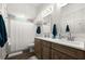 Modern bathroom featuring double sinks, a shower, and dark wood cabinets at 2302 S Atlantic Ave, New Smyrna Beach, FL 32169