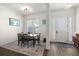 Bright dining area with hardwood floors and modern dining table at 2302 S Atlantic Ave, New Smyrna Beach, FL 32169