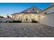 Inviting front entrance of a charming two-story home with a covered porch at 2302 S Atlantic Ave, New Smyrna Beach, FL 32169