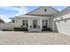 Front entrance with porch and paver driveway at 2302 S Atlantic Ave, New Smyrna Beach, FL 32169