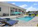 Stunning pool with ample lounge chairs for relaxation at 2302 S Atlantic Ave, New Smyrna Beach, FL 32169