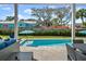 Covered patio overlooking the refreshing pool at 2302 S Atlantic Ave, New Smyrna Beach, FL 32169