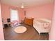 Bright bedroom with wood floors and plenty of space for a crib at 2309 Lime Tree Dr, Edgewater, FL 32141