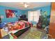 Fun bedroom with vibrant decor and plenty of toys at 2309 Lime Tree Dr, Edgewater, FL 32141