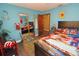 Playful bedroom with colorful decor and built in closet at 2309 Lime Tree Dr, Edgewater, FL 32141