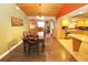 Dining room with dark wood table and access to kitchen at 2309 Lime Tree Dr, Edgewater, FL 32141