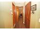 Long hallway with doors leading to bedrooms and other rooms at 2309 Lime Tree Dr, Edgewater, FL 32141