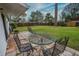 Backyard with patio furniture and large grassy area at 2325 Willow Oak Dr, Edgewater, FL 32141