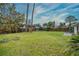 Large backyard with grassy area and wooden fence at 2325 Willow Oak Dr, Edgewater, FL 32141