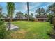 Large backyard with grassy area and wooden fence at 2325 Willow Oak Dr, Edgewater, FL 32141