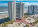 Aerial view of beachfront highrise building and parking at 2545 S Atlantic Ave # Ph4, Daytona Beach, FL 32118