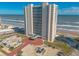 Aerial view of beachfront highrise building with parking at 2545 S Atlantic Ave # Ph4, Daytona Beach, FL 32118