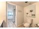 Guest bathroom with toilet and view of bedroom at 2545 S Atlantic Ave # Ph4, Daytona Beach, FL 32118