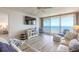 Bright living room features ocean views and hardwood floors at 2545 S Atlantic Ave # Ph4, Daytona Beach, FL 32118