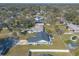 Aerial view of a house with a backyard and boat, showing convenient water access at 2717 Needle Palm Dr, Edgewater, FL 32141