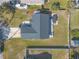 High-angle view of a single-Gathering home with a sizable backyard and patio at 2717 Needle Palm Dr, Edgewater, FL 32141