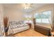 Cozy bedroom with a daybed, a window with blinds, and hardwood floors at 2717 Needle Palm Dr, Edgewater, FL 32141